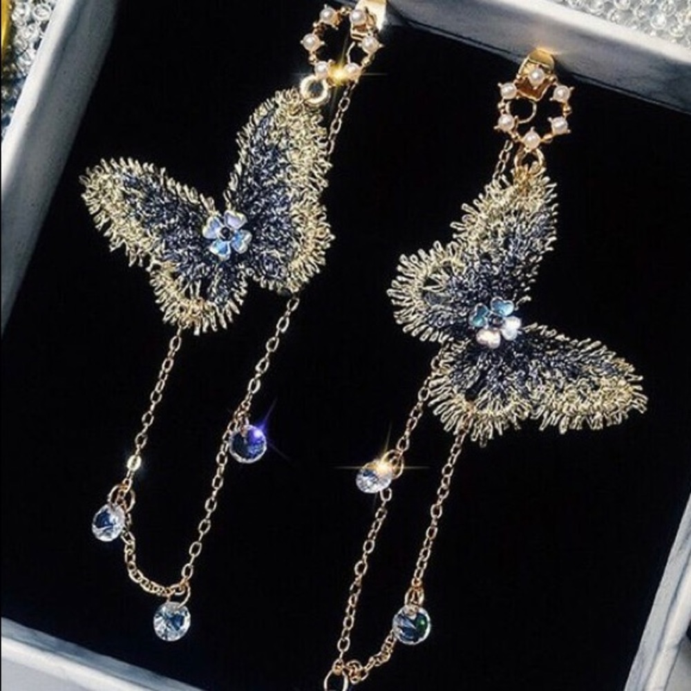 Purple butterfly design earrings.